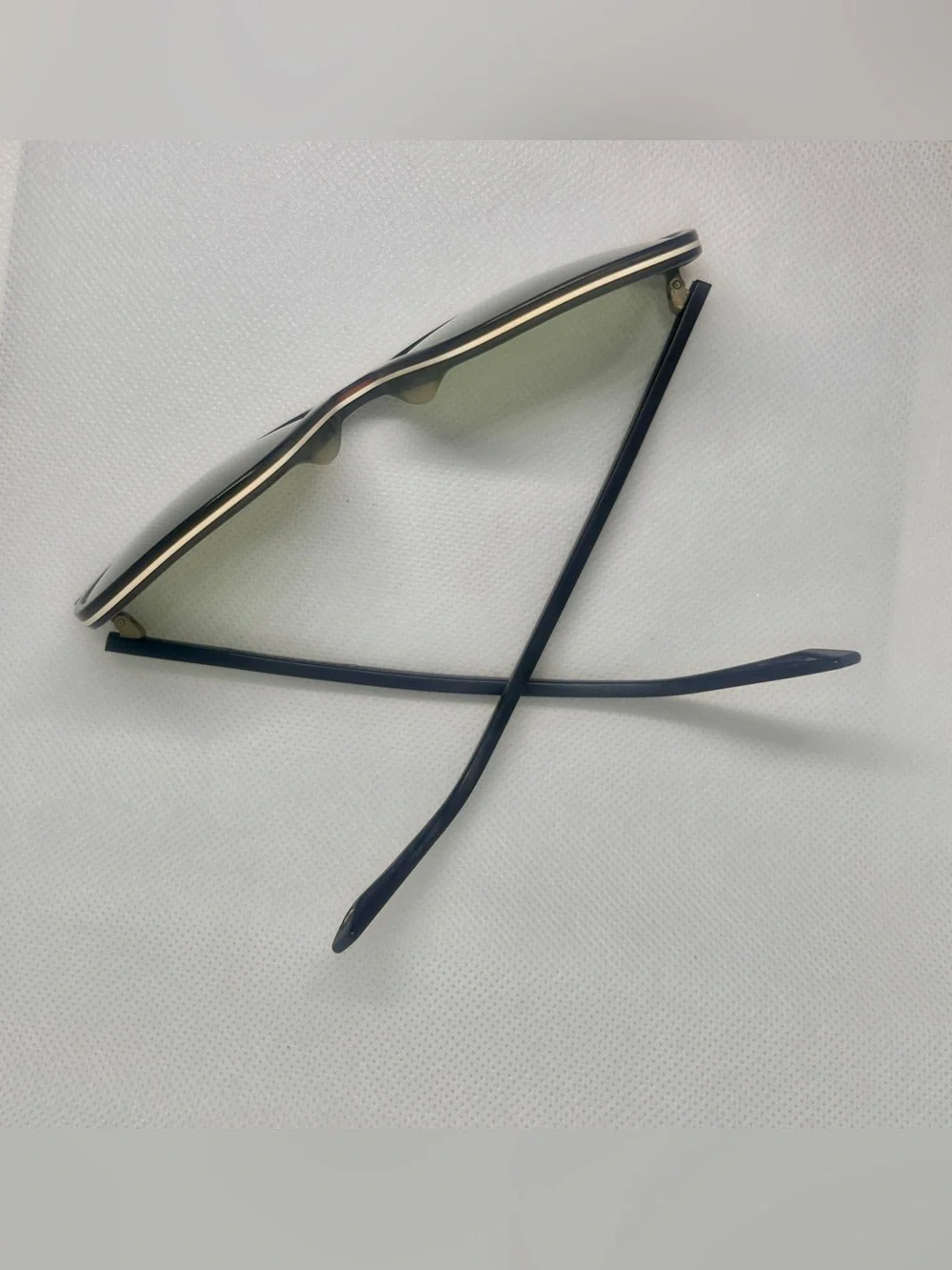 Warby Parker’s Fletcher Black Sunglasses with Green Lenses